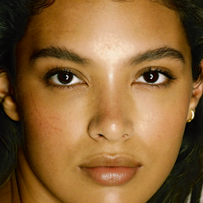 Model wearing MYCO Foundation 634 Light Warm - vegan mushroom-powered foundation for light warm golden skin