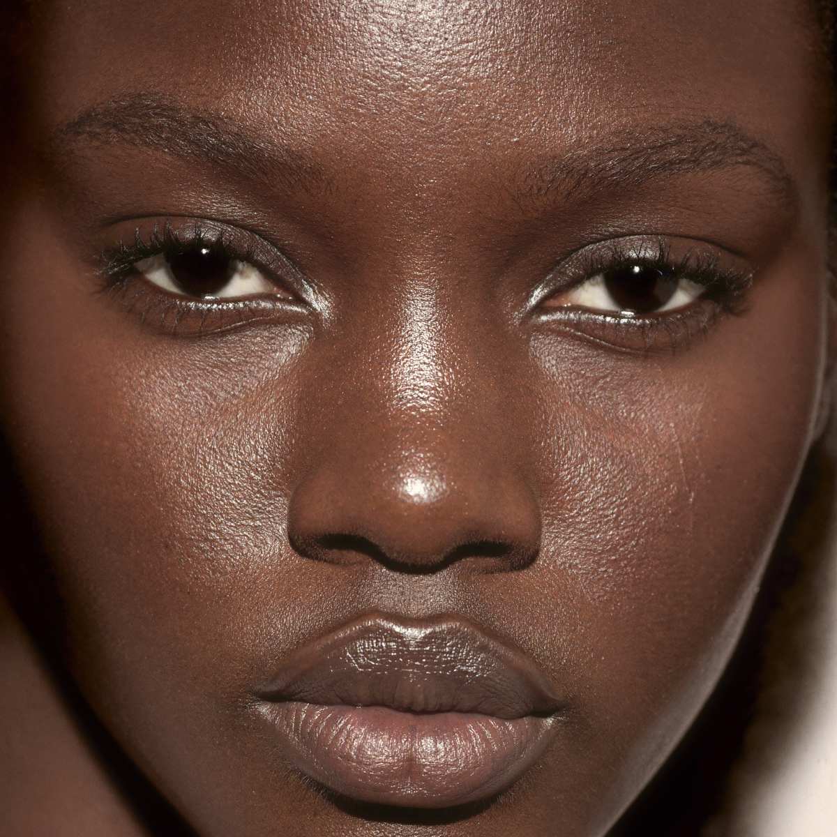 Model wearing MYCO Foundation 640 Deep Cool - vegan mushroom-powered foundation for deep cool skin