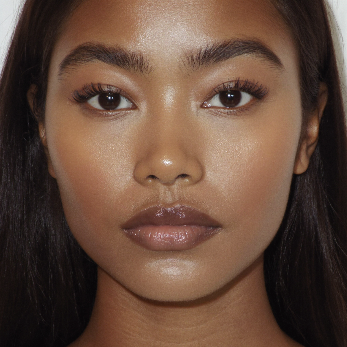 Model wearing MYCO Foundation 652 Medium-Tan Neutral - vegan mushroom-powered foundation for medium-tan neutral skin