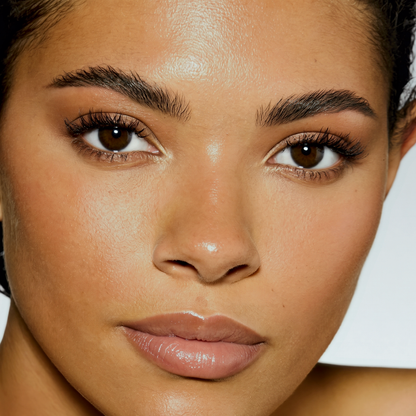Model wearing MYCO Foundation 656 Medium Warm - vegan mushroom-powered foundation for medium warm skin