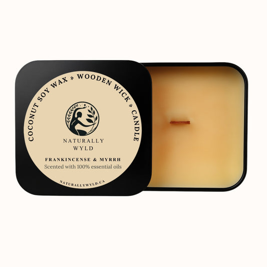 Naturally Wyld Frankincense and Myrrh candle in a reusable tin with wooden wick and coconut soy wax, made with essential oils for a grounding scent