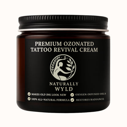 Black jar of Premium Ozonated Tattoo Revival Cream by Naturally Wyld on a white background