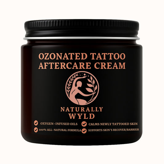 Black jar of Ozonated Tattoo Aftercare Cream with 'Naturally Wyld' branding on a white background