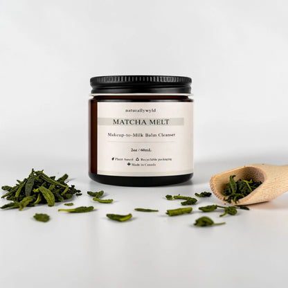 Matcha Melt balm cleanser jar with matcha leaves on a white background