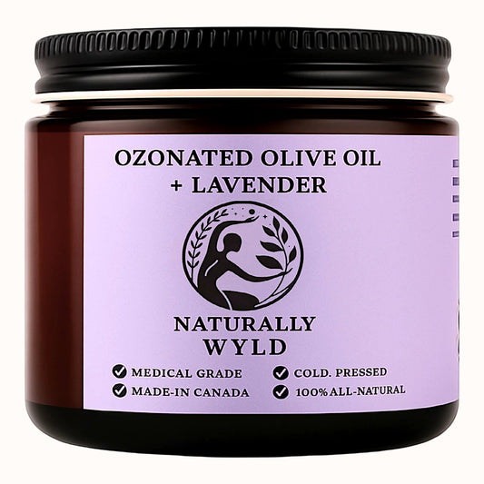 Amber jar labeled Naturally Wyld Ozonated Olive Oil + Lavender. Cold-pressed, 100% all-natural calming balm made in Canada. Medical-grade olive oil infused with lavender for skincare and relaxation.
