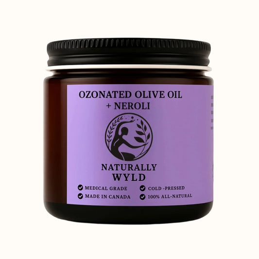 Amber jar of Naturally Wyld Ozonated Olive Oil + Neroli. Cold-pressed, medical-grade natural balm made in Canada. Infused with neroli essential oil for skin brightening and rejuvenation. 100% all-natural formula.