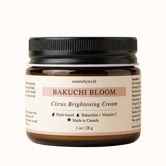 Bakuchi Bloom Citrus Brightening Cream — amber glass jar with bakuchiol, vitamin C, rosehip, and sea buckthorn plant-based formula by Naturally Wyld