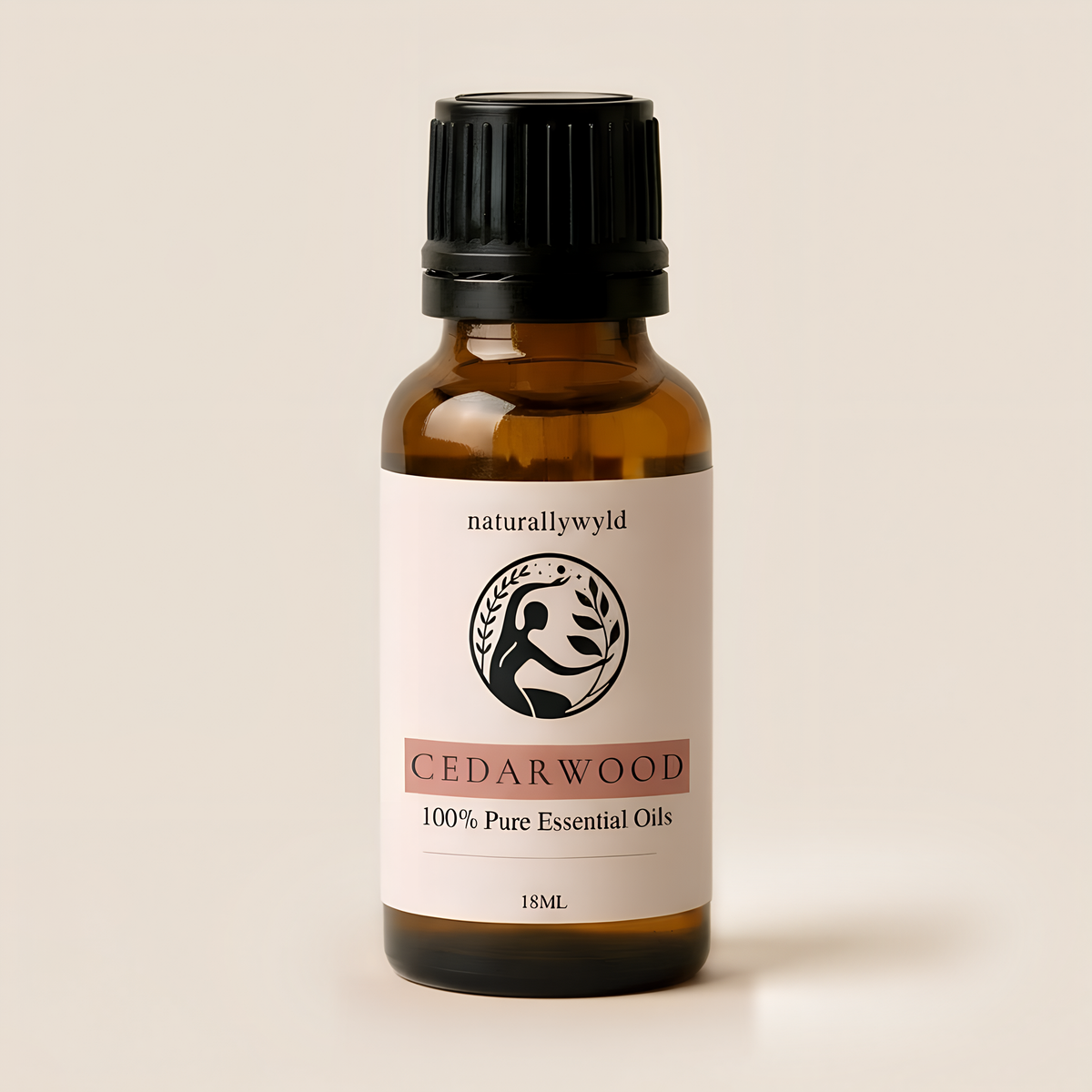 Amber 18ml dropper bottle of Naturally Wyld Pure Cedarwood Essential Oil with terracotta rose label