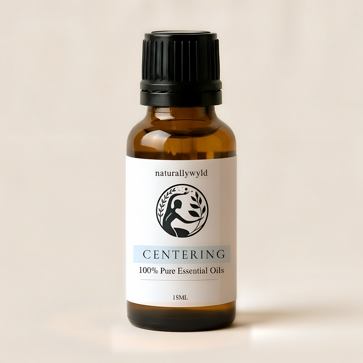 Amber 18ml dropper bottle of Naturally Wyld Centering essential oil blend with pale ice blue label
