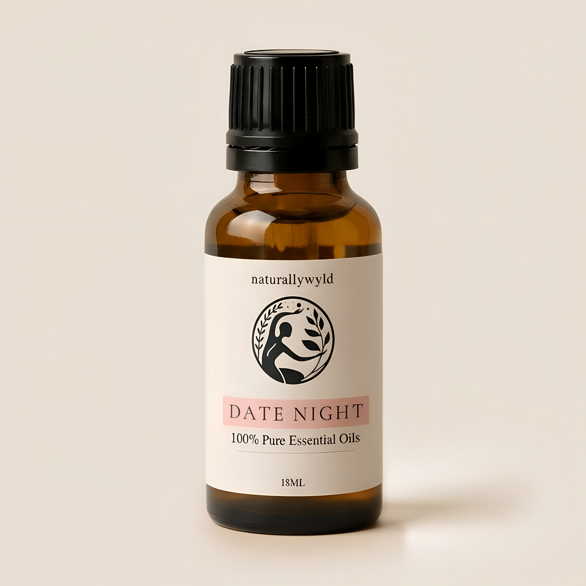 Amber 18ml dropper bottle of Naturally Wyld Date Night essential oil blend with soft blush pink label