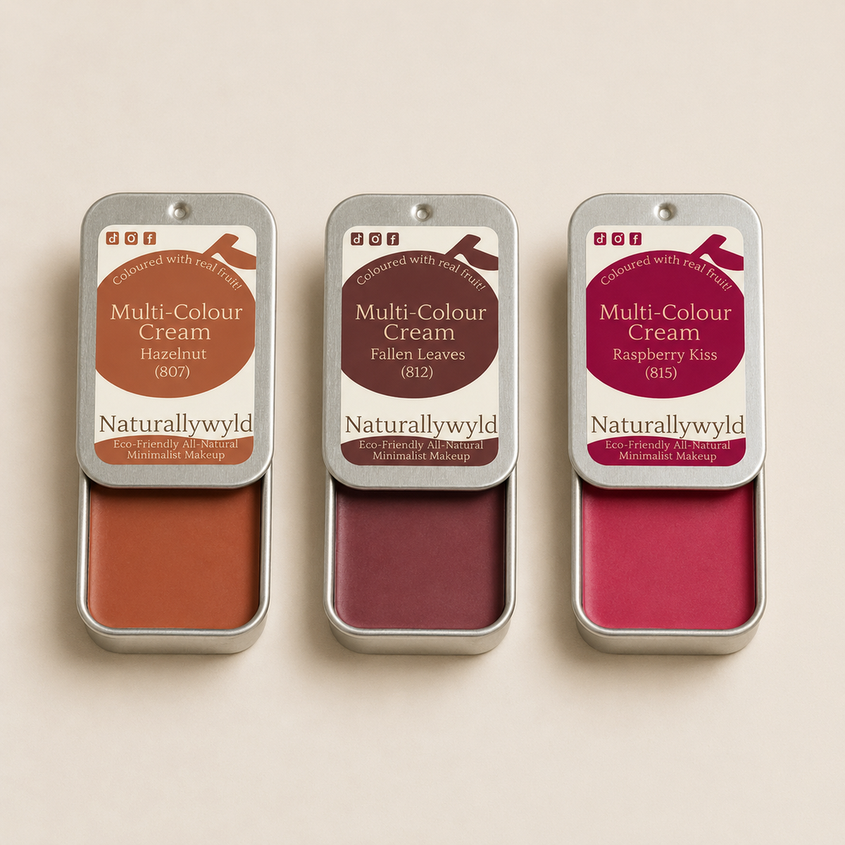 Multi-Colour Cream tester pack with three open fruit-pigmented cream tins by Naturally Wyld
