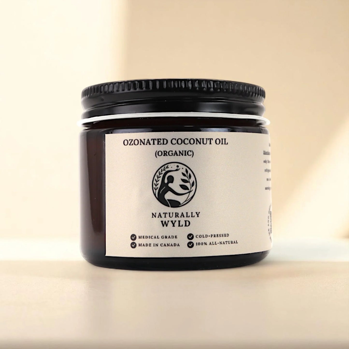 Naturally Wyld ozonated coconut oil front label – organic cold-pressed coconut oil infused with medical-grade ozone, used in minimalist skincare routines as a gentle, all-natural balm alternative to support dry or sensitive skin; 100% natural, handmade in Canada.