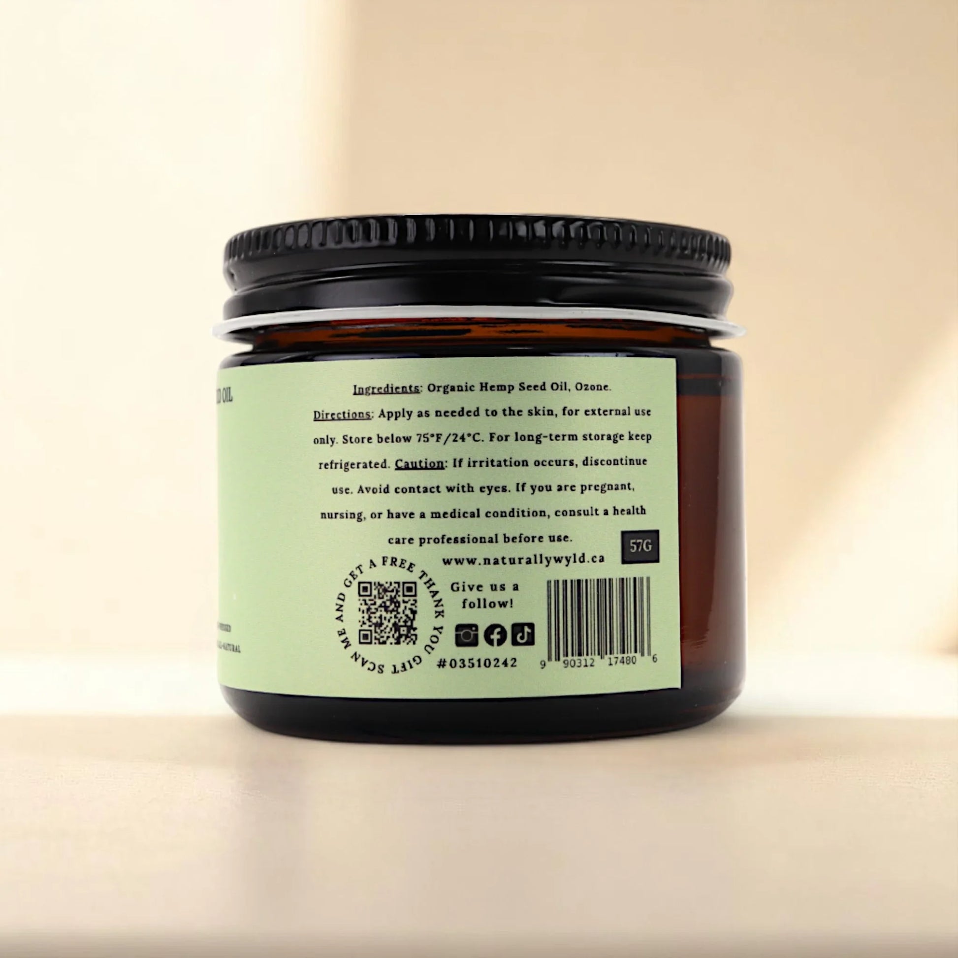 Back label of Naturally Wyld ozonated hemp seed oil jar showing ingredients (organic hemp oil, ozone), external use instructions, and storage info; a clean-label product often chosen for natural skincare and wellness routines focused on skin clarity, hydration, and barrier support.
