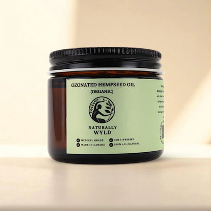Naturally Wyld ozonated hemp seed oil front label – cold-pressed organic hemp oil infused with ozone, commonly used in natural skincare routines for those seeking support with acne-prone skin, irritation, dry patches, or overall skin clarity; handmade in Canada in small batches with all-natural ingredients.