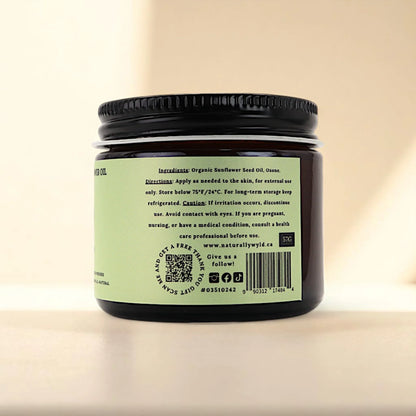 Back label of Naturally Wyld ozonated sunflower seed oil jar, featuring full ingredient list (organic sunflower seed oil, ozone), external use guidance, and storage recommendations; a clean-label ozone oil favored for minimalist routines and plant-based topical care.