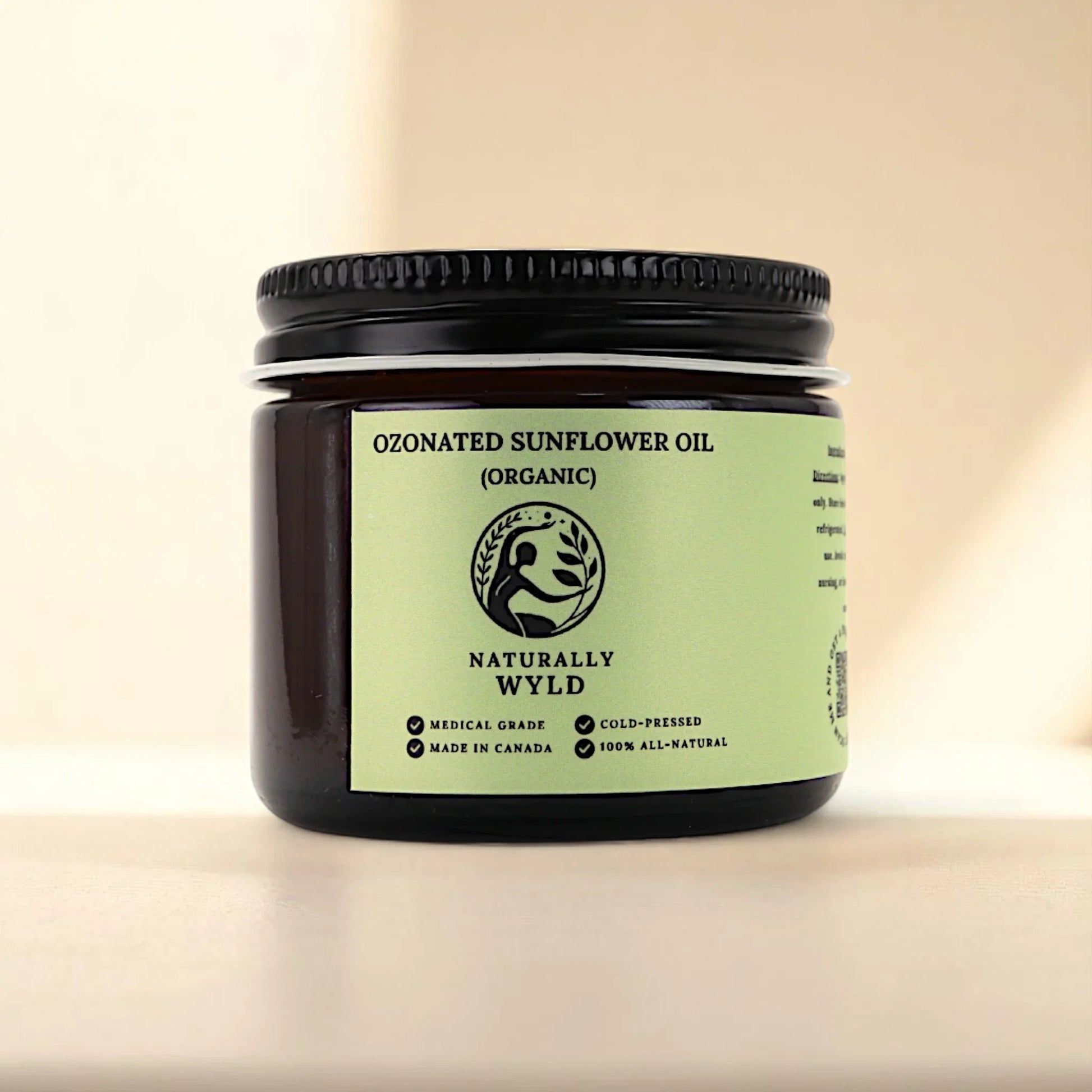 Naturally Wyld ozonated sunflower seed oil front label – lightweight, organic sunflower oil cold-pressed and infused with ozone, commonly used in clean skincare routines for gentle hydration and supporting skin balance; handmade in Canada with all-natural ingredients.