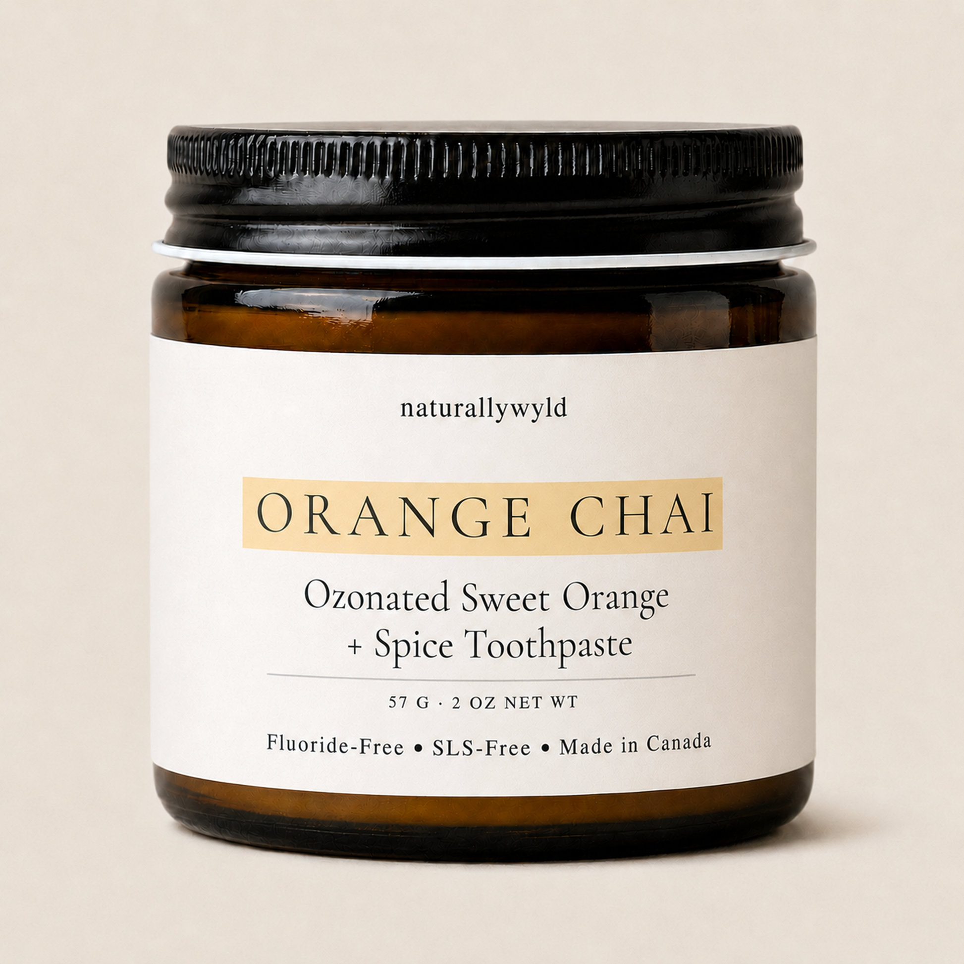 Orange Chai ozonated toothpaste in amber glass jar by Naturally Wyld