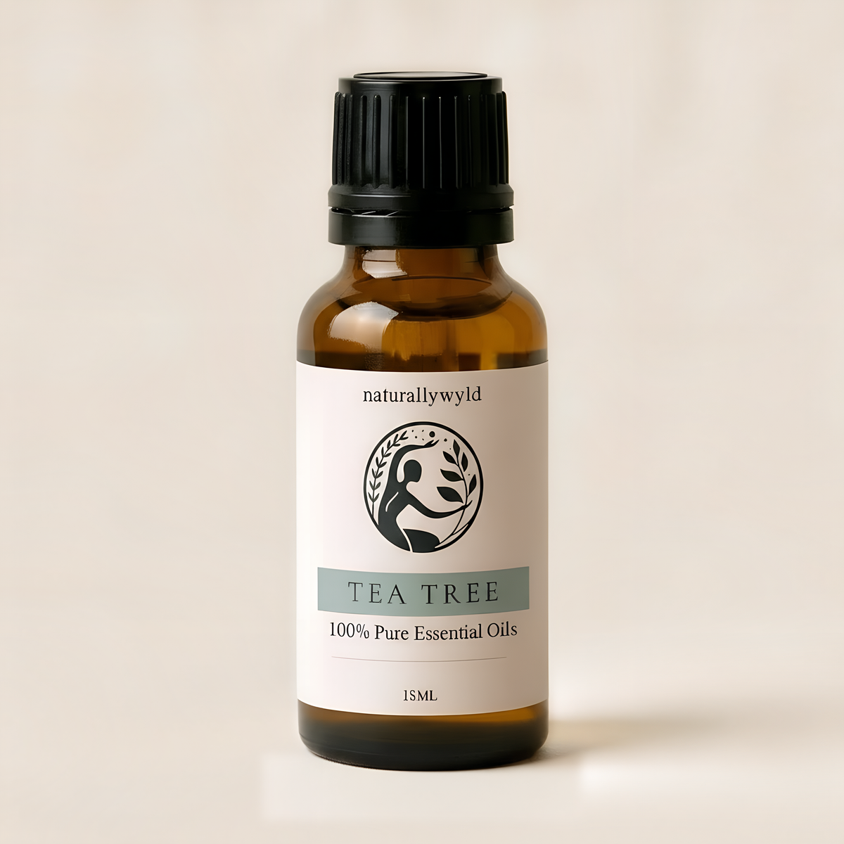 Amber 18ml dropper bottle of Naturally Wyld Pure Tea Tree Essential Oil with grey-sage green label