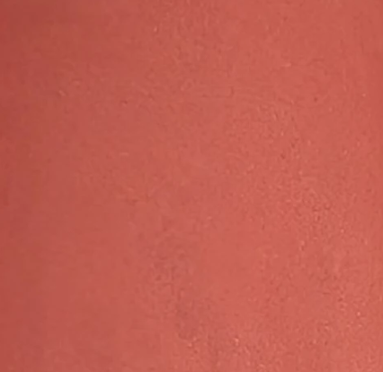 Terracotta Sunset fruit-pigmented multi-stick texture swatch — warm sun-baked rust-orange shade