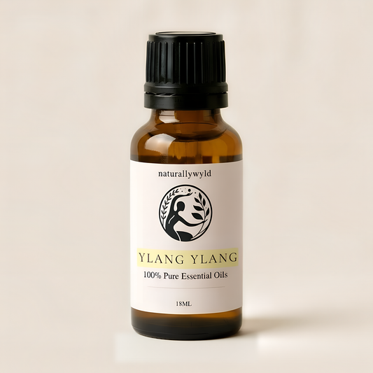 Amber 18ml dropper bottle of Naturally Wyld Pure Ylang Ylang Essential Oil with pale lemon yellow label